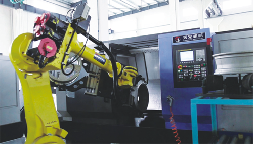 Wheel machining robot handling system and fixture